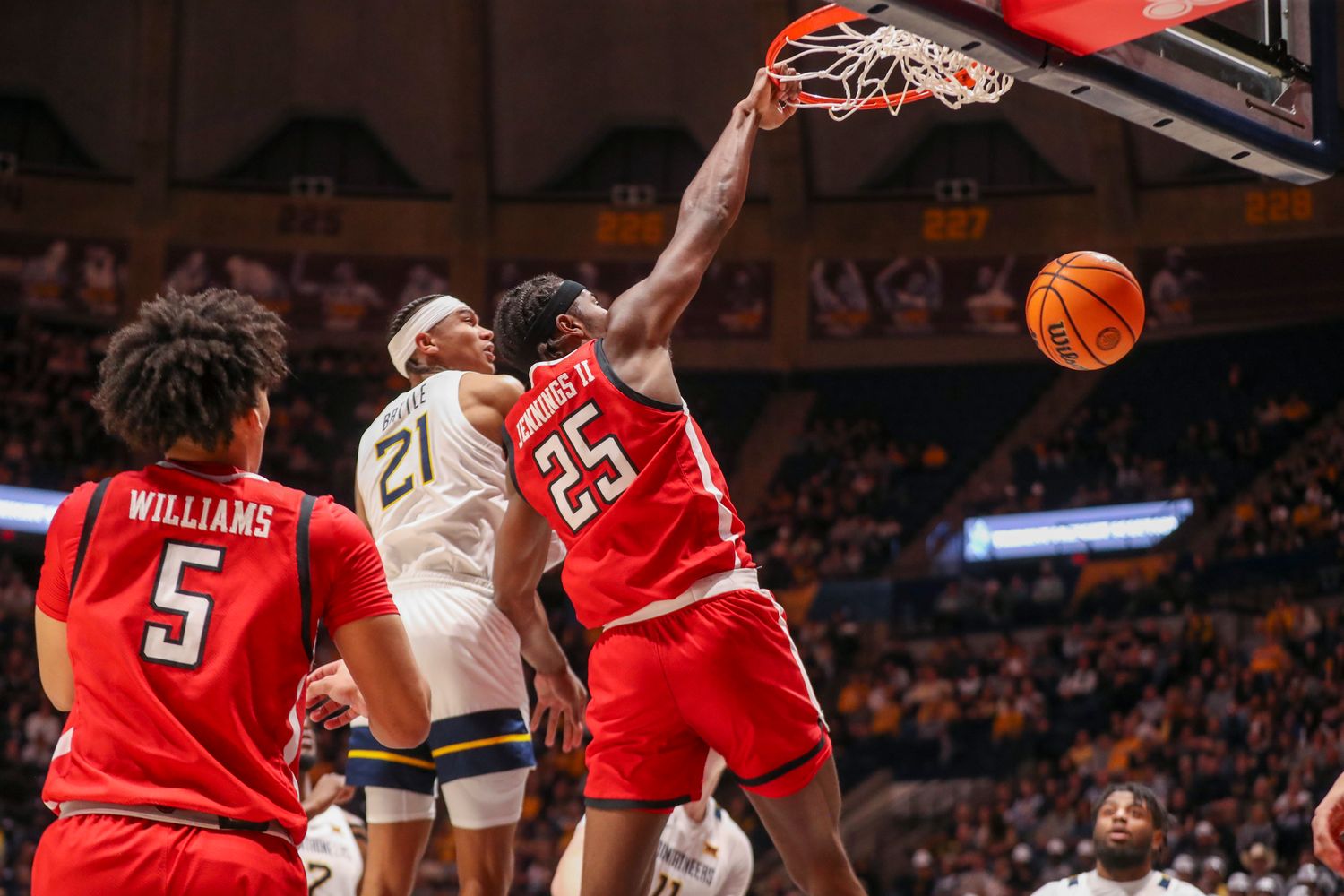 Texas Tech Red Raiders forward Robert Jennings (25) dunks the ball during the first half against the West Virginia Mountaineers at WVU Coliseum.